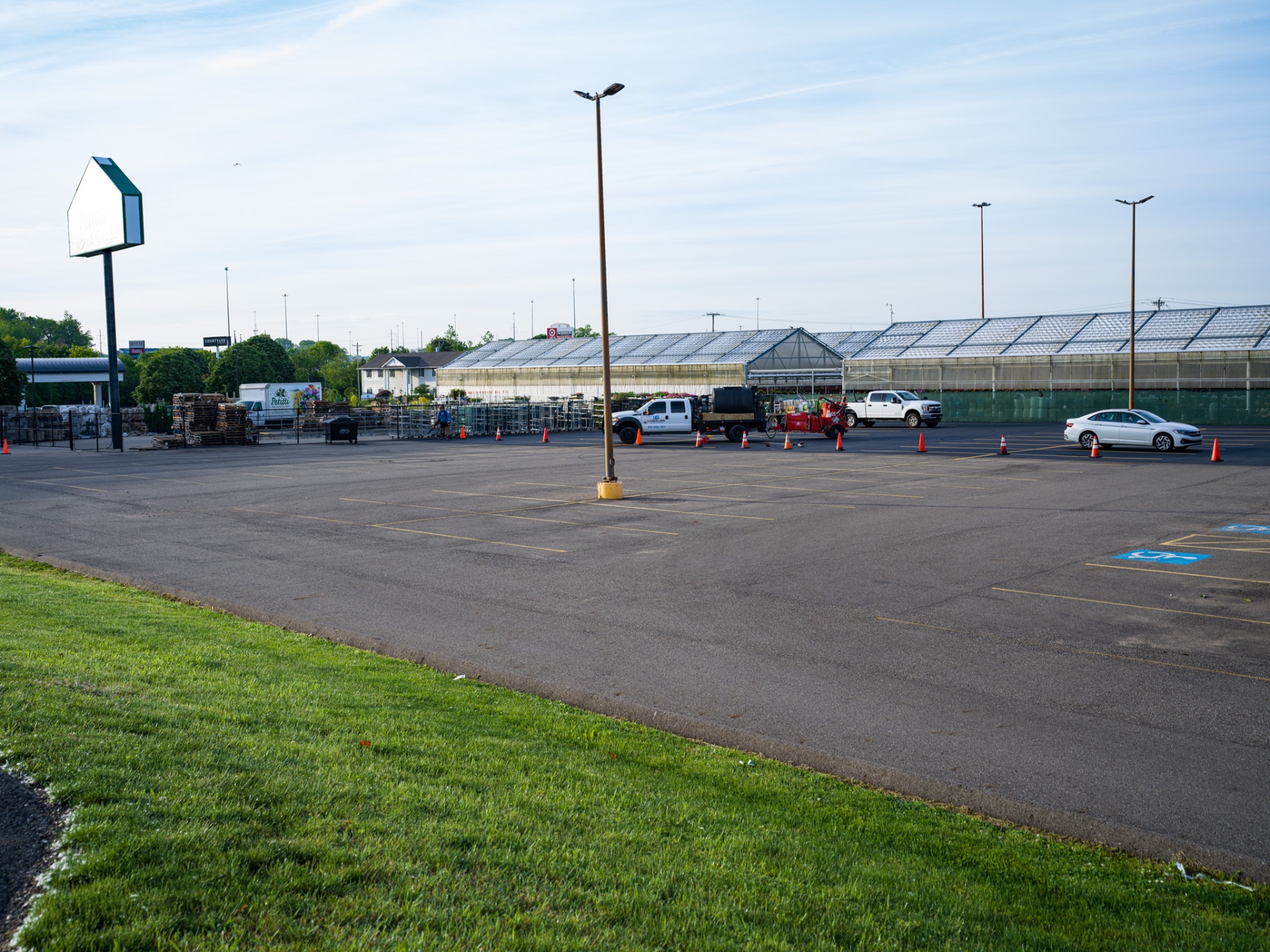 Fresh sealcoat and yellow line striping on large commercial lot in Ohio